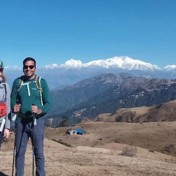 Ashmita Trek and Tours guest pic at ridge with background mountain view