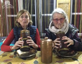 Clients enjoying traditional drink Tongba also known as rice beer